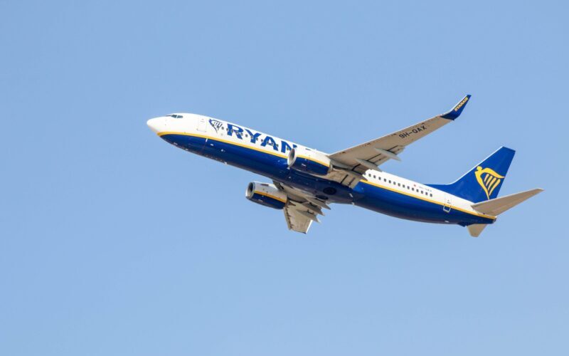 A Ryanair plane mid-flight. How to find the cheapest flights.