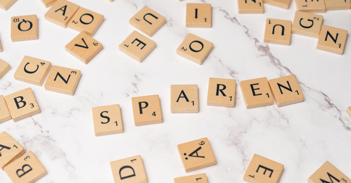 Monetising hobbies - Scrabble tiles scattered on a marble surface depicting creativity and wordplay.