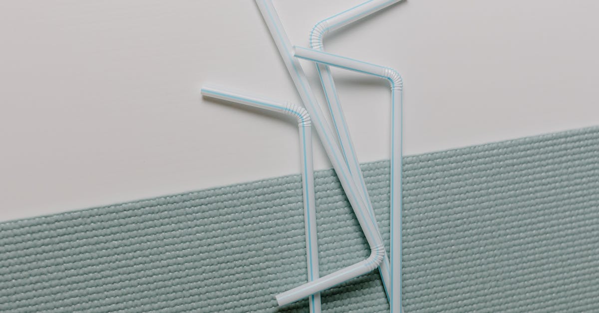income generation with household items - A modern close-up of plastic straws artistically arranged on a textured surface, ideal for design concepts.