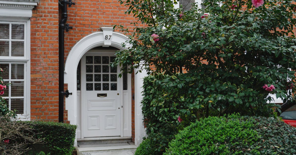 Rainwater harvesting UK - A picturesque red brick facade with vibrant greenery in London, England.