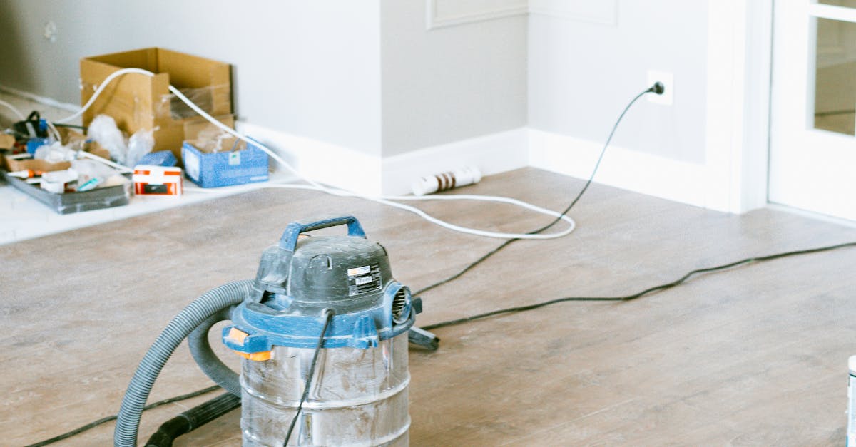 DIY savings - Vacuum and tools in a room undergoing renovation, showcasing home improvement.