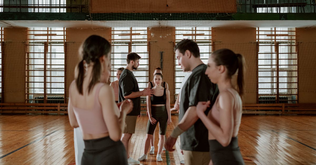 Affordable UK Fitness - A group of people practicing and training in a gym setting, focusing on teamwork and coordination.
