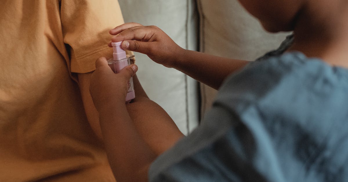 Childcare Sharing UK - Close-up of children engaging in pretend play with a toy syringe indoors.
