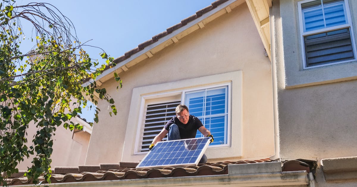 DIY solar panel installation UK - Solar technician installing photovoltaic panels on a sunny rooftop.