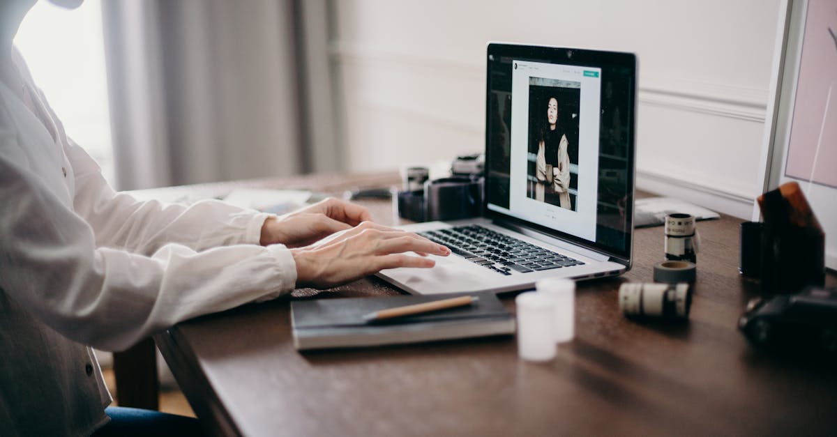 Cashback websites UK - A freelancer working on a laptop in a cozy home office, focusing on creative design tasks.